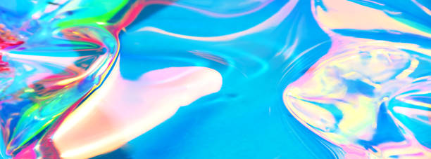 istock Holographic iridescent surface. Copy space. Bright colorful hologram background. Wrinkled abstract texture with multiple colors. Neon surface. Banner 1154314095