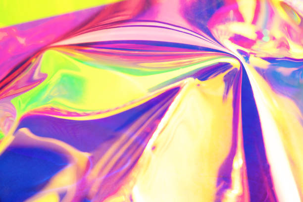 istock Holographic iridescent surface. Copy space. Bright colorful hologram background. Wrinkled abstract texture with multiple colors. Neon surface. 1154314134
