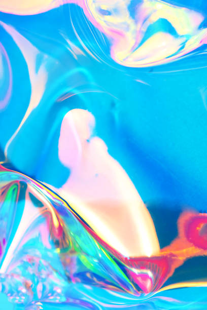 istock Holographic iridescent surface. Copy space. Bright colorful hologram background. Wrinkled abstract texture with multiple colors. Neon surface. 1154314231