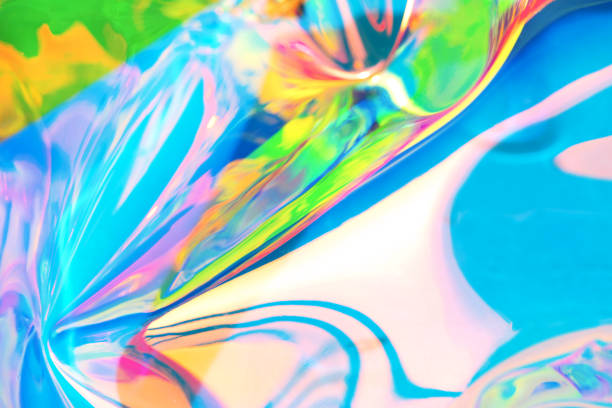 istock Holographic iridescent surface. Copy space. Bright colorful hologram background. Wrinkled abstract texture with multiple colors. Neon surface. 1154314247