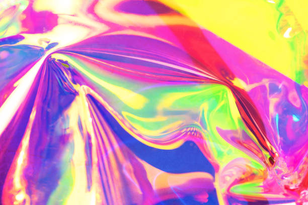 istock Holographic iridescent surface. Copy space. Bright colorful hologram background. Wrinkled abstract texture with multiple colors. Neon surface. 1154314251