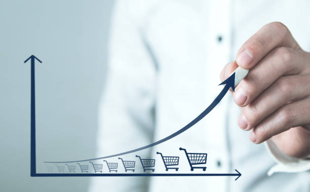 istock Shopping cart and growth graph. Increase in sales 1154317903