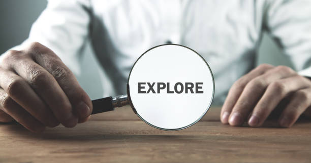 istock Man holding magnifying glass. Explore. Business 1154318054