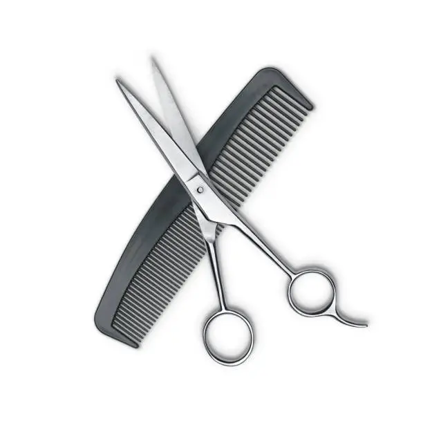 Photo of Hair cutting shears and comb isolated on white