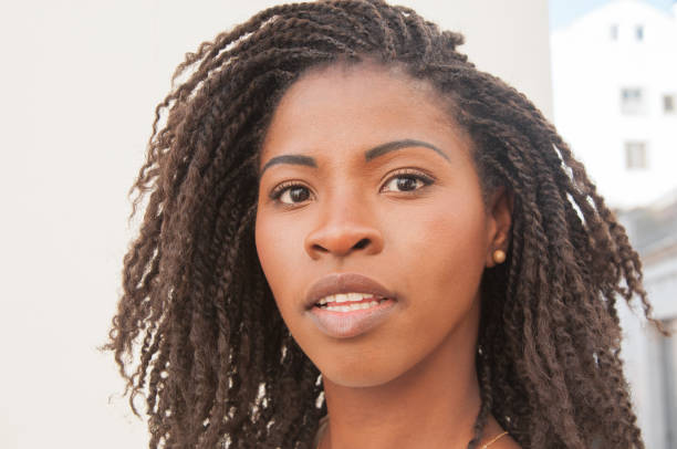 istock Pensive young black woman looking at camera 1154318677