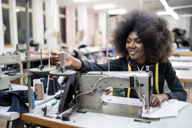 istock African worker in fashion factory using sewing machine 1154318698