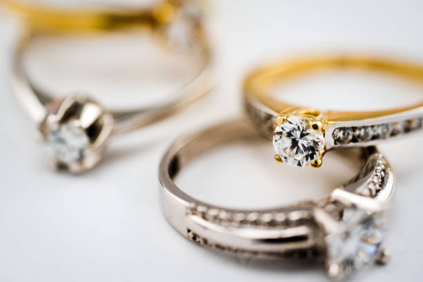 istock Engagement diamond wedding ring group on white background, diamond, golden rings 1154319541