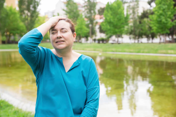 istock Excited emotional woman touching her head 1154320087