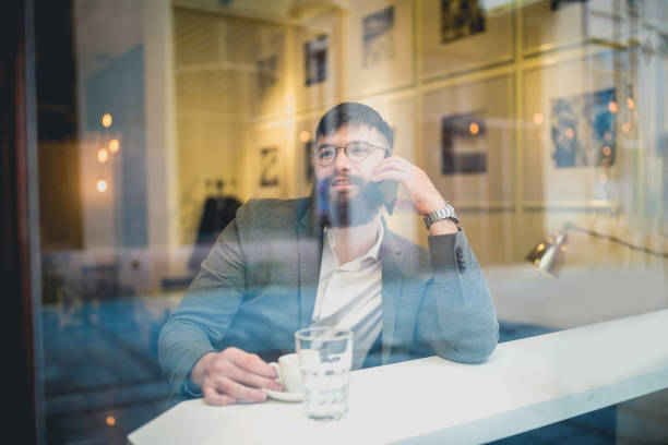 istock Hipster businessman working in cafe on coffee break 1154322949