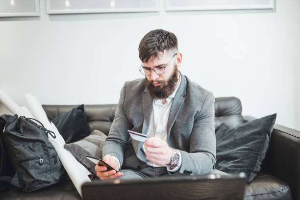 istock Hipster businessman working in cafe on coffee break 1154322958