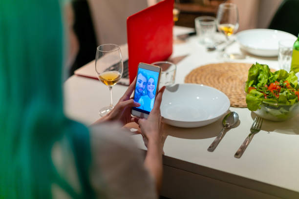 istock Young couple taking a selfie at dinner table 1154322986