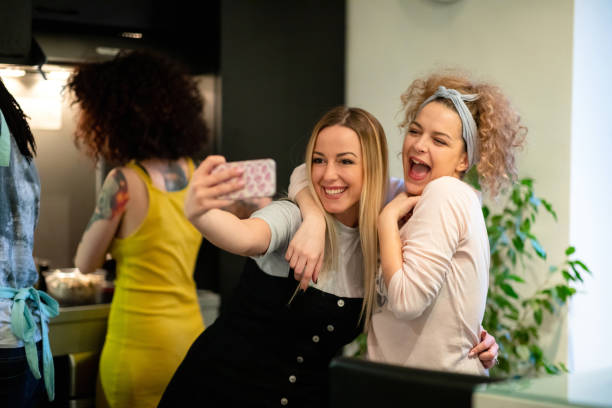 istock Female flatmates taking a happy selfie 1154323020
