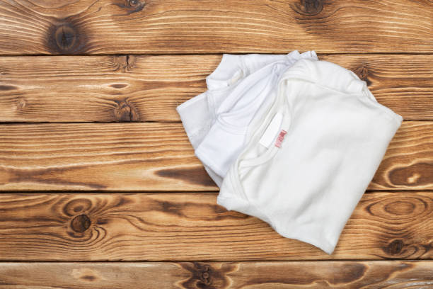 istock Baby stuff on wooden table 1154324158