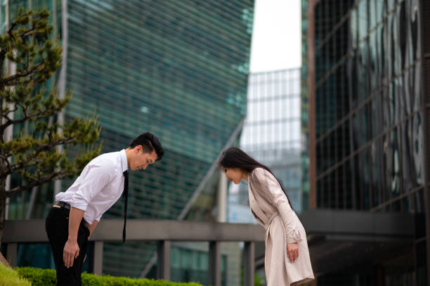 istock Entrepreneurs bowing in respect at downtown 1154324295
