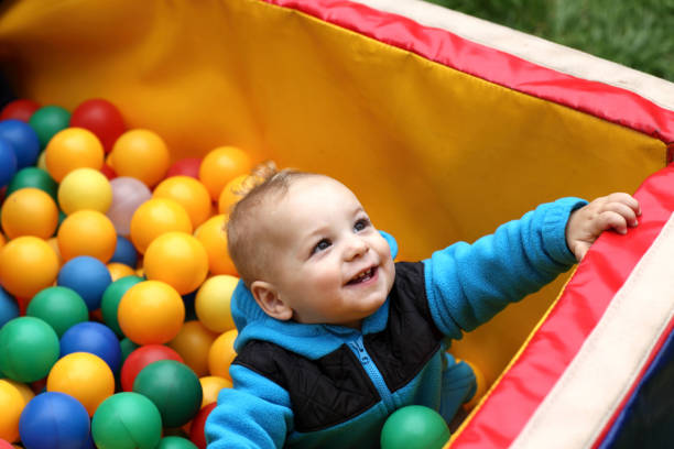 istock Toddler in box of balls 1154327097