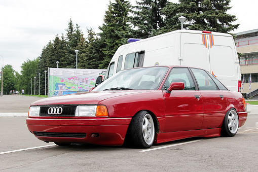 Moscow. Russia - May 20, 2019: The red Audi 80 is parked on the street. Car with very low ground clearance. Tuned under the Stance style. Light alloy wide wheels