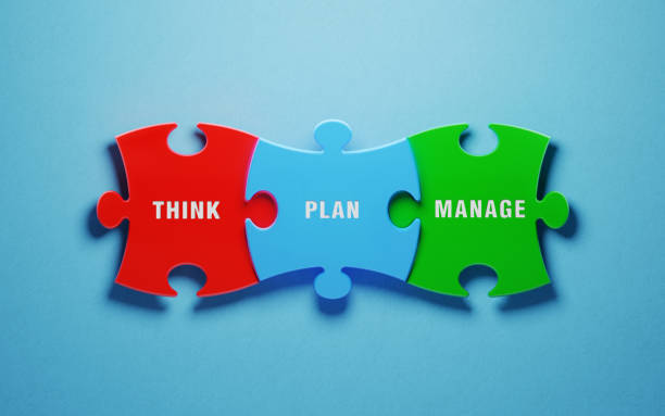 istock Management Concept - Colorful Jigsaw Puzzle Pieces On Blue Background 1154328369