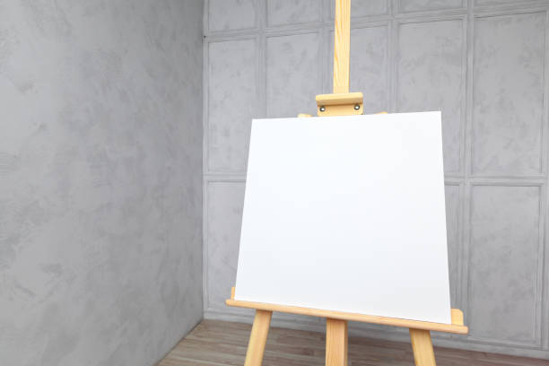 istock Wooden easel in the room 1154330259