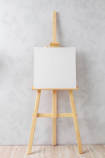 istock Wooden easel in the room 1154330654