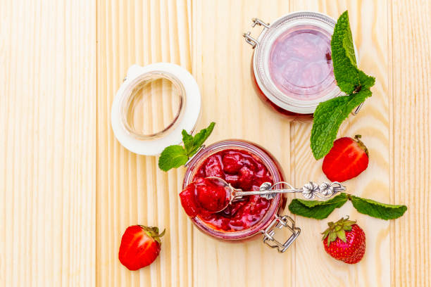 istock Strawberry jam in a glass jar 1154332460