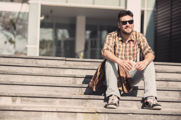 istock Cheerful young man on a coffee break 1154332587
