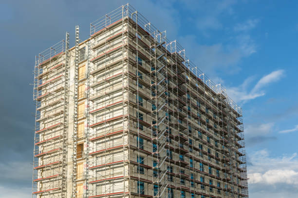 istock Construction of a skyscraper with scaffolding on the facade 1154333210
