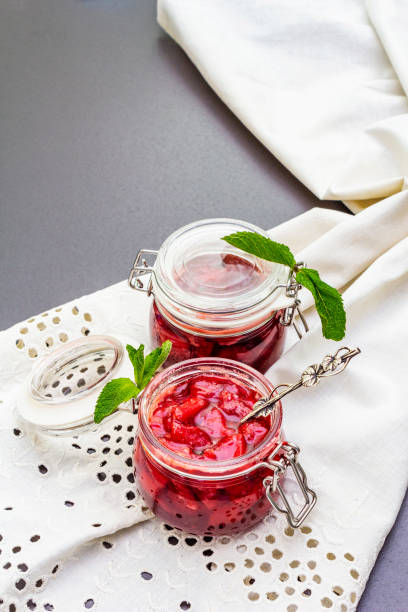 istock Strawberry jam in a glass jar 1154333369