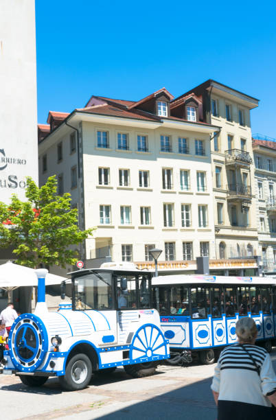 fribourg, fr / switzerland / 30 may 2019: the blue and white mini train travels through the historic city of fribourg with tourists on board - freiburg im breisgau fribourg canton transportation germany imagens e fotografias de stock