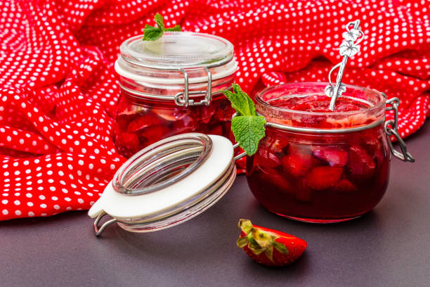 istock Strawberry jam in a glass jar 1154333597