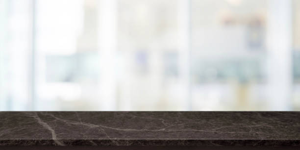 istock Empty back stone marble table top and blurred abstract interior from restaurant and coffee shop background - can used for display or montage your products. 1154338715
