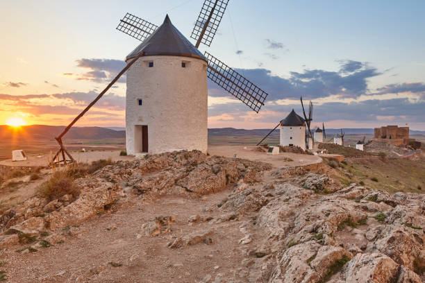 istock Traditional antique windmills at sunset in Spain. Consuegra, Toledo 1154338993