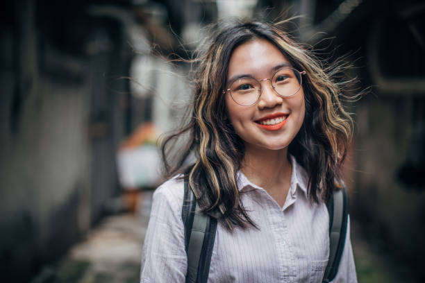 istock Charming young lady standing in alley downtown 1154341845