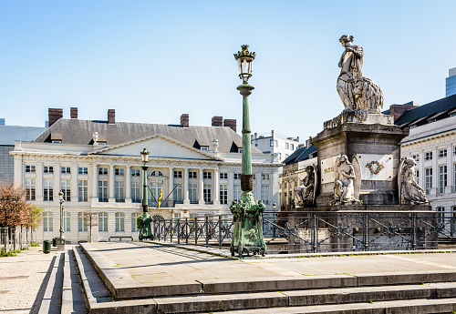 Brussels, Belgium - April 20, 2019: The Martyrs' square is home to the Memorial to the martyrs of the 1830 revolution and neo-classical buildings like the Flemish minister-president's cabinet office.