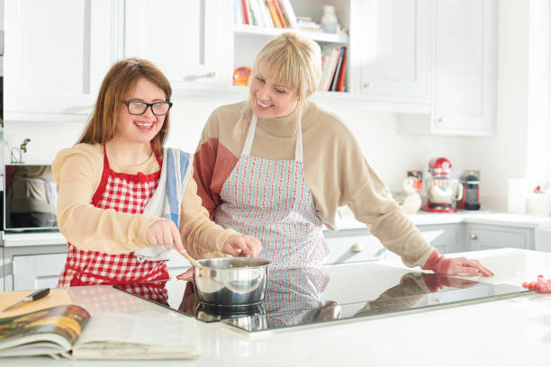 istock mother and daughter cooking lunch 1154347815