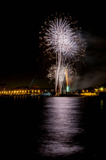istock fireworks at night next to the beach 1154354483