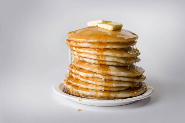 World famous fast flipping pancake makers - Flapjacks cooked on large black griddle