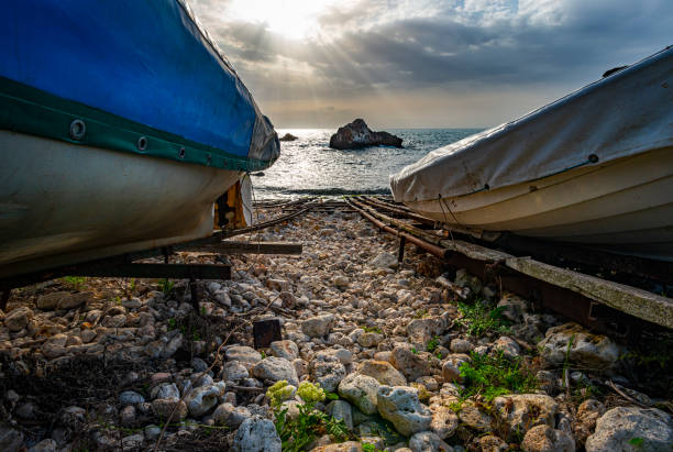 Boats on the Black Sea shore in Tulenovo village, Bulgaria. Balkans, Europe.