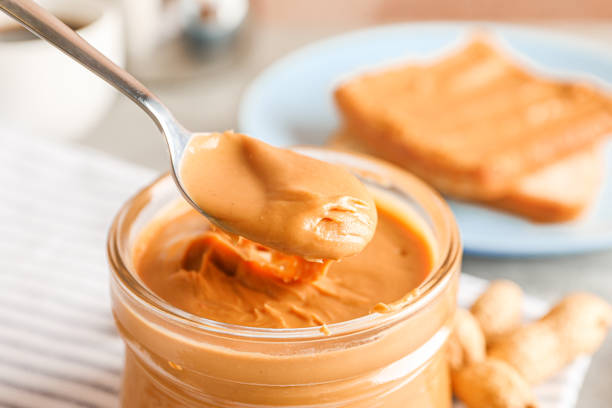 istock Yummy peanut butter breakfast on grey background, space for text and closeup 1154355791