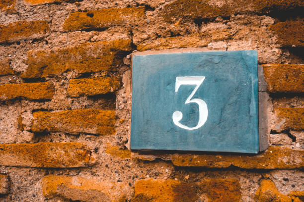 istock ancient door sign with number 3 1154359404