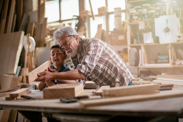 istock Grandfather teaching his grandson 1154359960