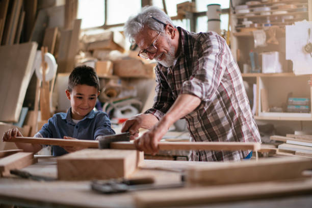 istock Grandfather teaching his grandson 1154360036