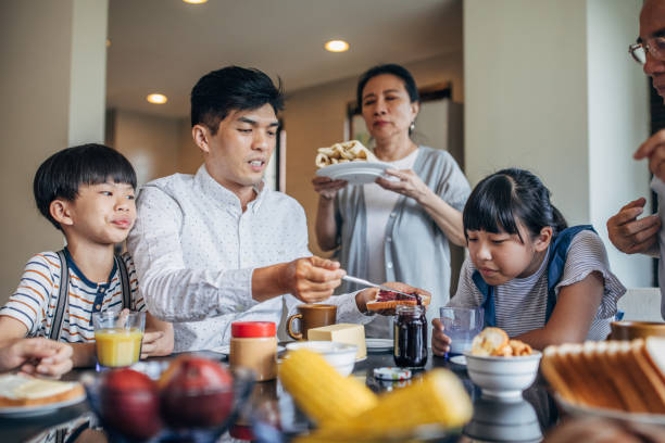 istock Family having meal together 1154360232