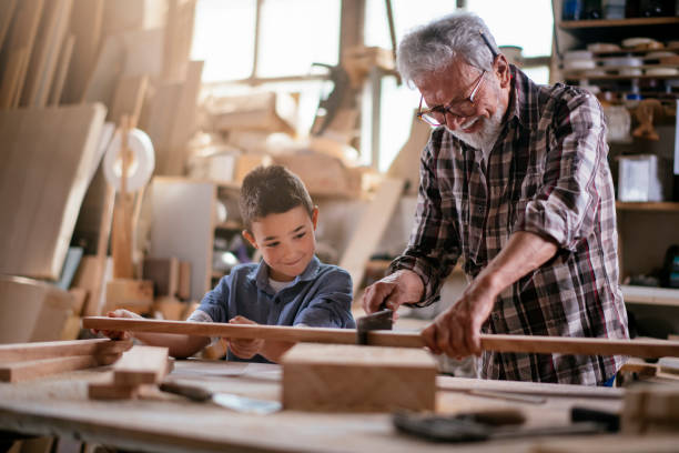 istock Grandfather teaching his grandson 1154360247