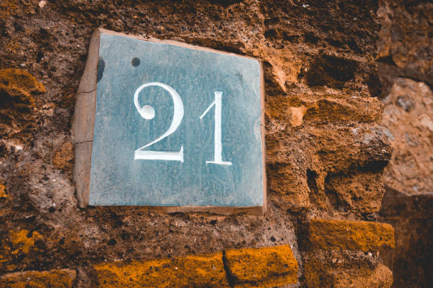 istock stone sign of ancient building with number 21 1154360355