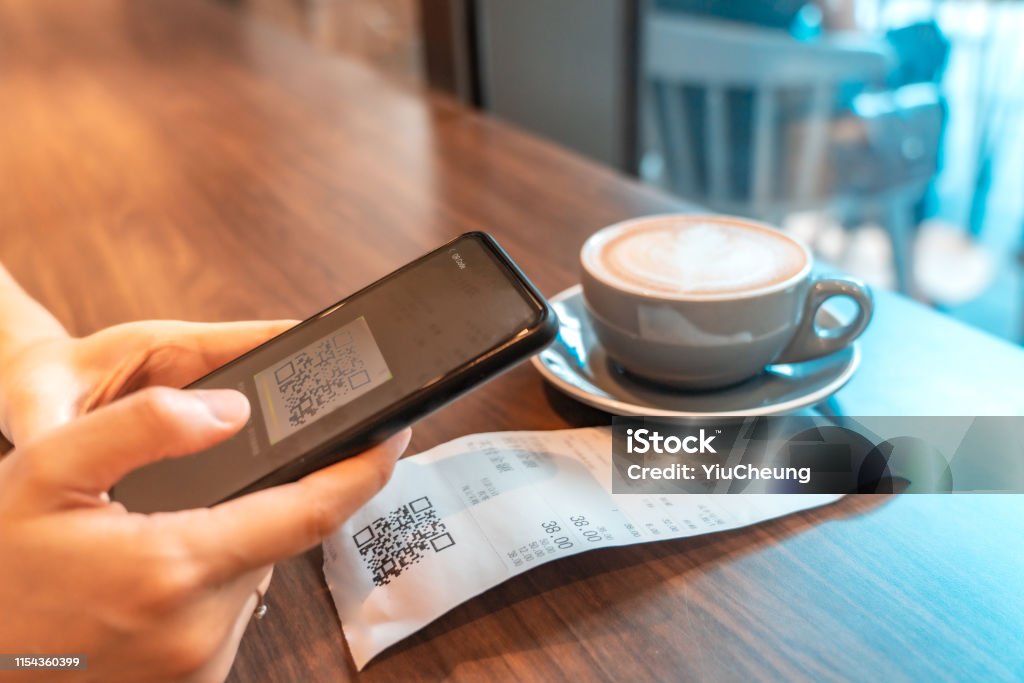 Electronic Payment Moments in Asia Asian woman use smartphone payment in shopping mall by scanning QRcode. QR Code Stock Photo