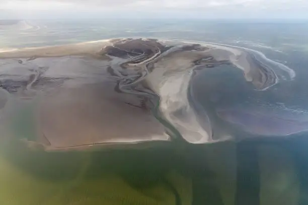 Aerial view Dutch island Rottumerplaat, coastline with mudflats and natural channels