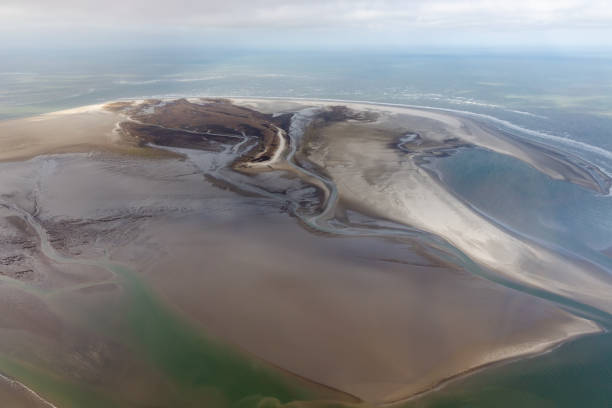 istock Aerial view Dutch island Rottumerplaat, coastline with mudflats and channels 1154363011