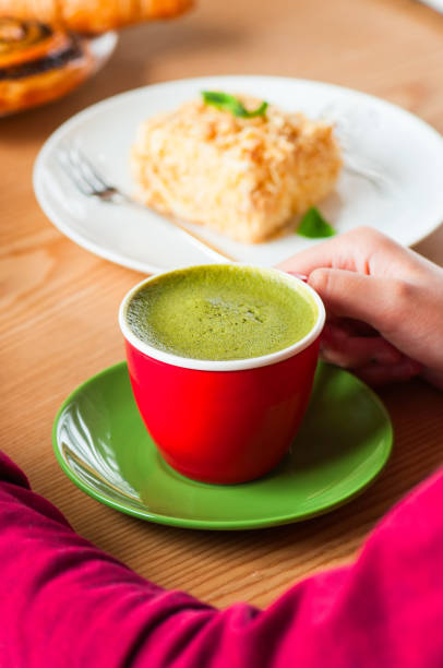 istock Green matcha latte in a red cup. 1154367615