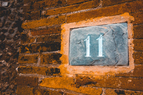 istock number 11 in warm tonage on brick facade 1154371660