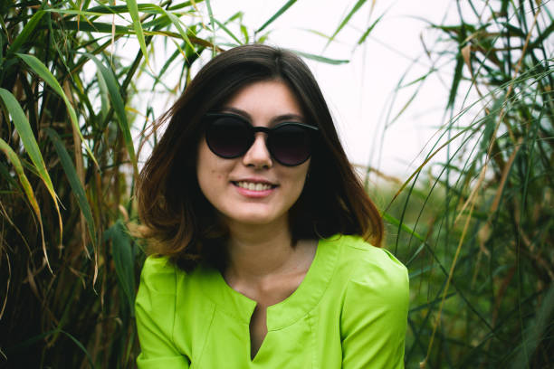 istock young woman among the grass 1154372104